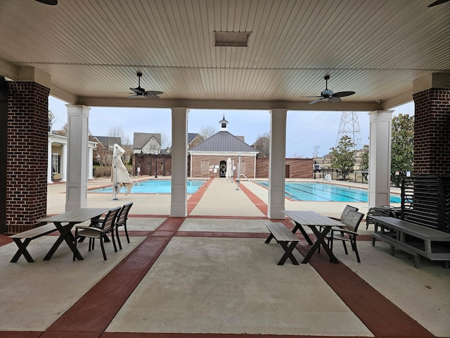 exterior space with a ceiling fan, a patio, and fence