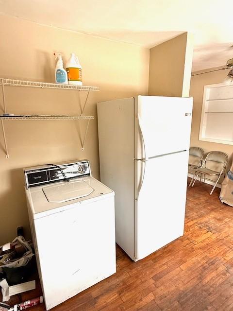 washroom featuring laundry area, washer / clothes dryer, and wood finished floors