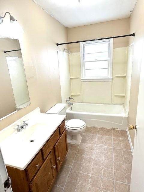 full bathroom with shower / tub combination, vanity, and toilet