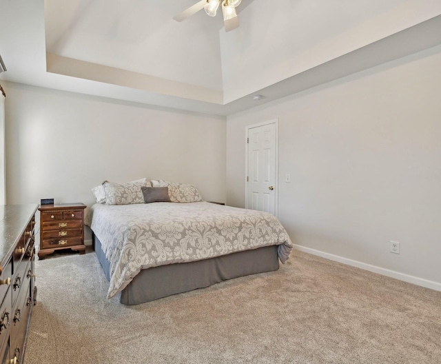 bedroom featuring carpet floors, ceiling fan, a towering ceiling, and baseboards