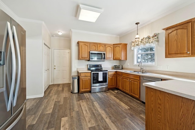 kitchen with brown cabinets, decorative light fixtures, stainless steel appliances, light countertops, and a sink