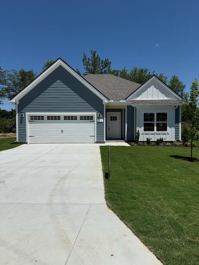 2 Country Cir, Manchester, TN 37355 - ranch-style home featuring board and batten siding, driveway, an attached garage, a front yard, and a shingled roof