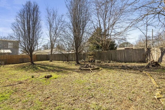 view of yard with a fenced backyard