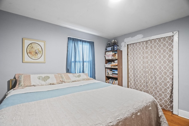 bedroom featuring wood finished floors