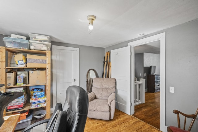home office with wood finished floors