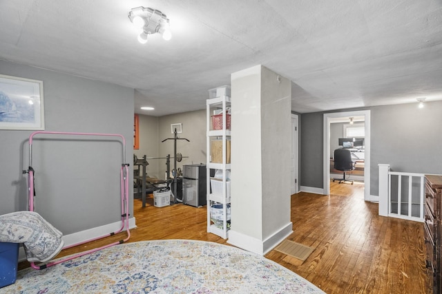 interior space with hardwood / wood-style flooring and baseboards