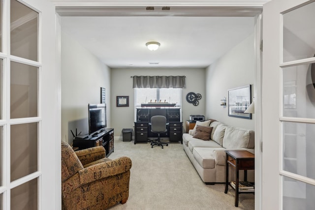 living room featuring light carpet and visible vents