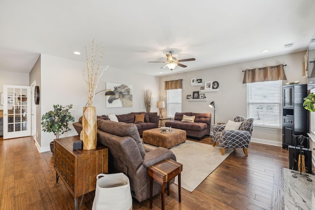 living area featuring recessed lighting, baseboards, and wood finished floors