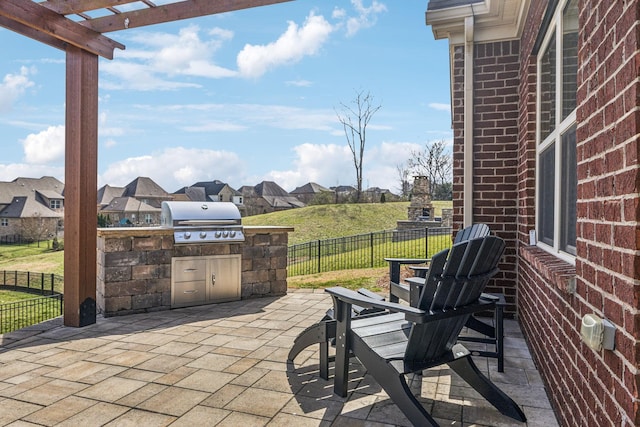 view of patio / terrace featuring a residential view, fence, and area for grilling