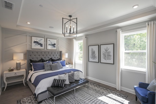 bedroom featuring baseboards, visible vents, dark wood finished floors, a notable chandelier, and recessed lighting