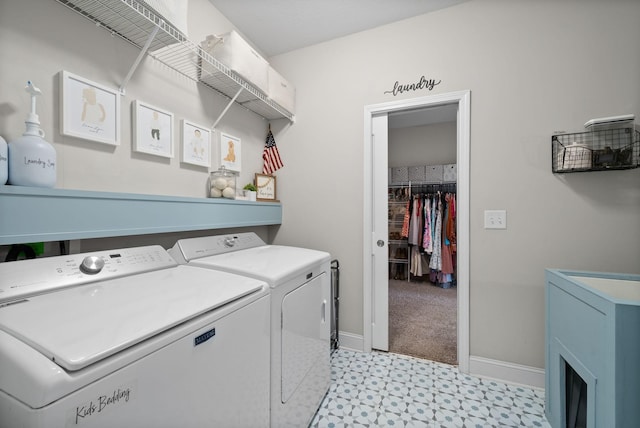 laundry room featuring light floors, laundry area, independent washer and dryer, and baseboards