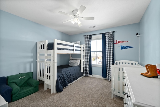 bedroom with baseboards, visible vents, a ceiling fan, and light colored carpet