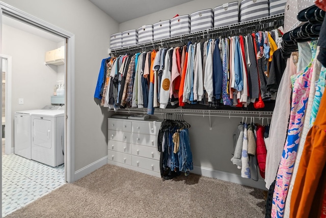 spacious closet with carpet flooring and washing machine and clothes dryer