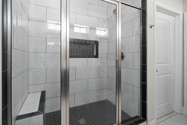 bathroom with a shower stall