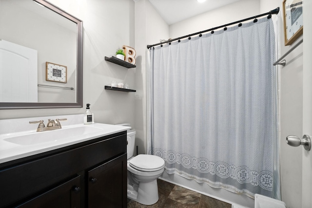 bathroom featuring toilet, curtained shower, and vanity