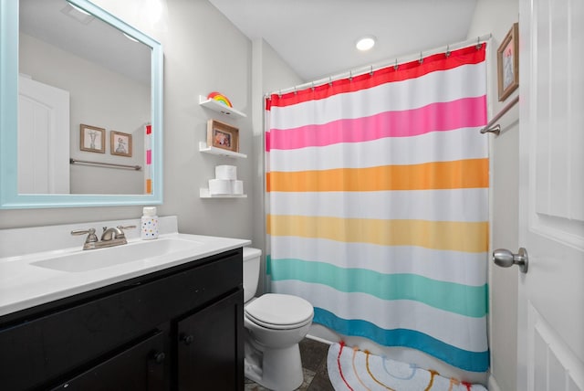 bathroom with toilet, a shower with curtain, and vanity