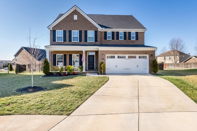 view of front of house featuring concrete driveway, brick siding, a front yard, and fence