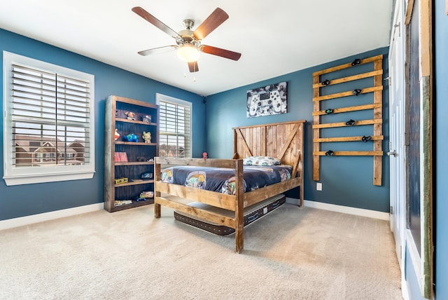 bedroom with carpet floors, ceiling fan, and baseboards