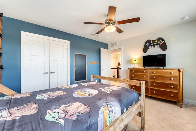 bedroom featuring a ceiling fan, visible vents, a closet, and carpet flooring