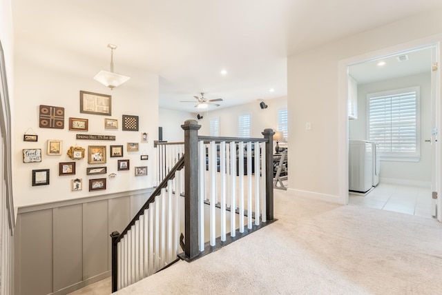 hall with light carpet, visible vents, washer / clothes dryer, an upstairs landing, and recessed lighting