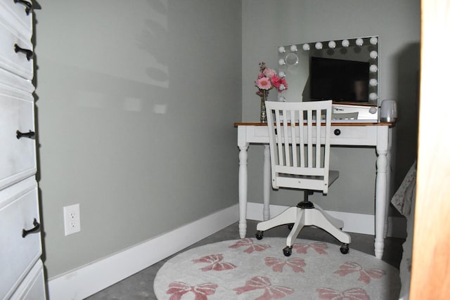 office featuring concrete floors and baseboards