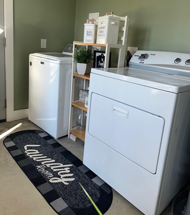 clothes washing area with laundry area and washing machine and clothes dryer