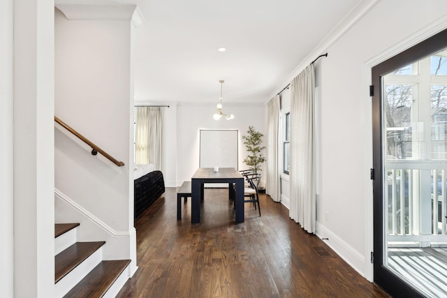 unfurnished dining area featuring a notable chandelier, baseboards, stairway, dark wood finished floors, and crown molding