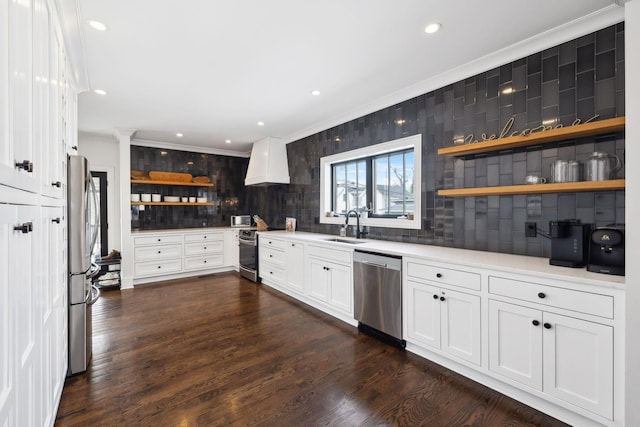 kitchen featuring white cabinets, custom range hood, stainless steel appliances, light countertops, and open shelves