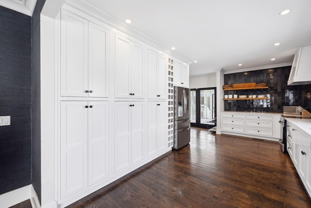 kitchen with dark wood-style flooring, white cabinetry, light countertops, appliances with stainless steel finishes, and open shelves