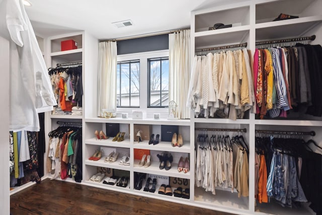 walk in closet with dark wood-style floors and visible vents