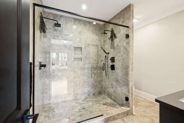 full bath with baseboards, a stall shower, vanity, and crown molding