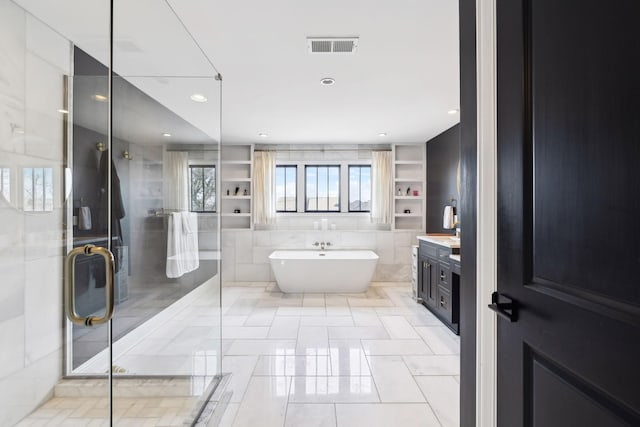 full bathroom with recessed lighting, a soaking tub, visible vents, a shower stall, and vanity