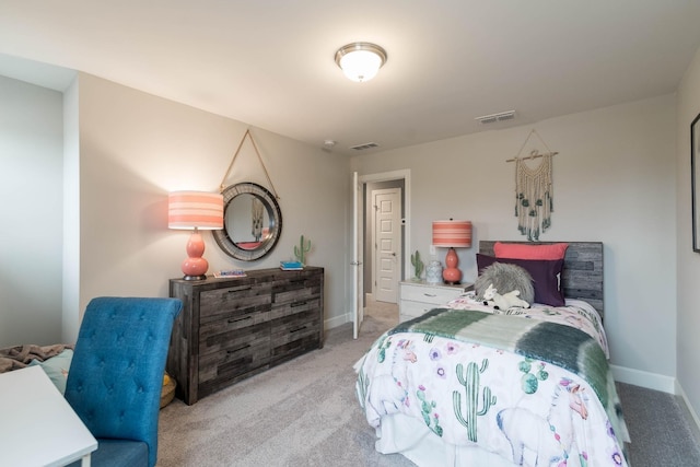 bedroom featuring baseboards, visible vents, and light colored carpet