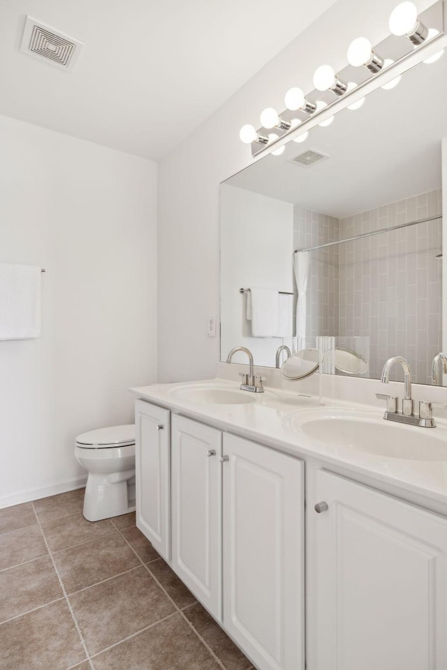 full bathroom featuring tile patterned floors, visible vents, a sink, and double vanity