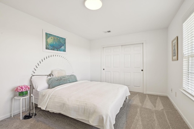 bedroom featuring carpet, visible vents, and baseboards