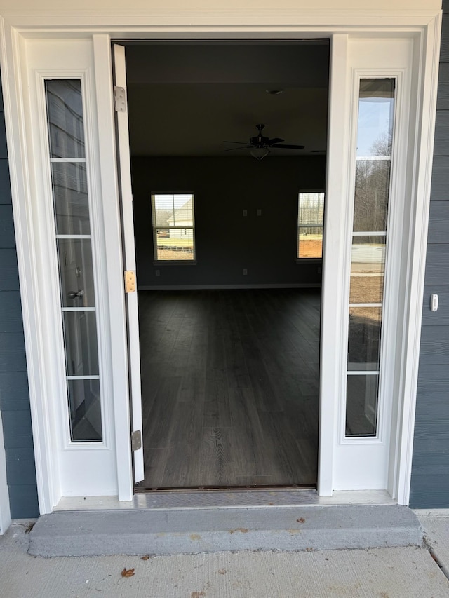 doorway to property with a garage