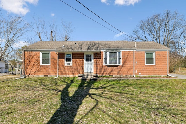 ranch-style house with entry steps, a front yard, and brick siding