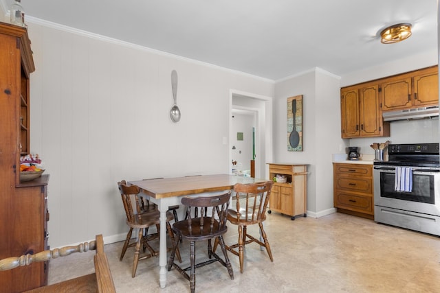 dining space featuring ornamental molding and baseboards