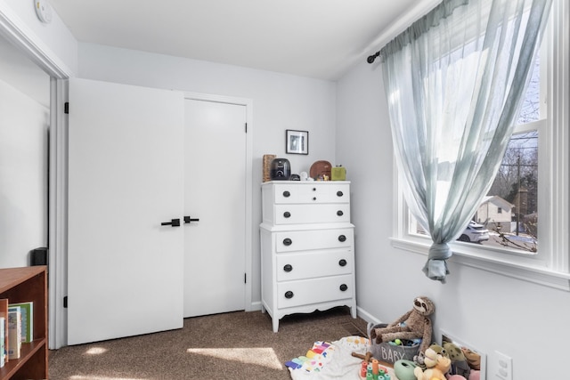 bedroom with dark colored carpet