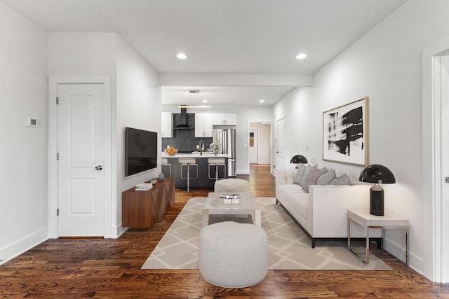 living room with baseboards, dark wood-style flooring, and recessed lighting