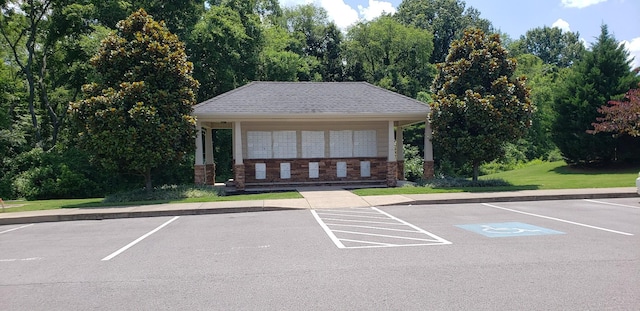 uncovered parking lot featuring mail area