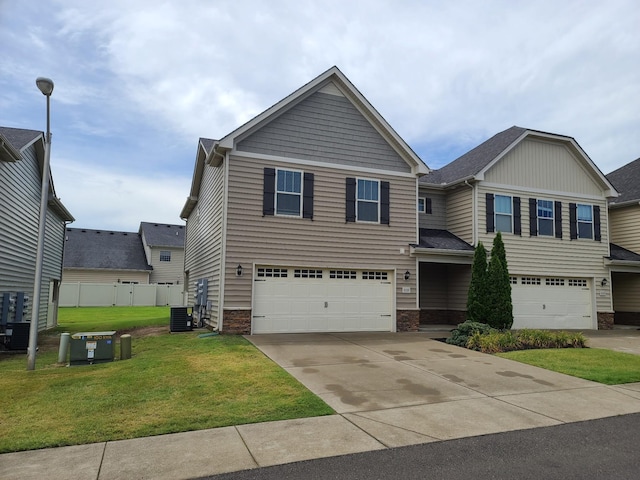 view of front facade with central air condition unit, concrete driveway, a front yard, fence, and a garage