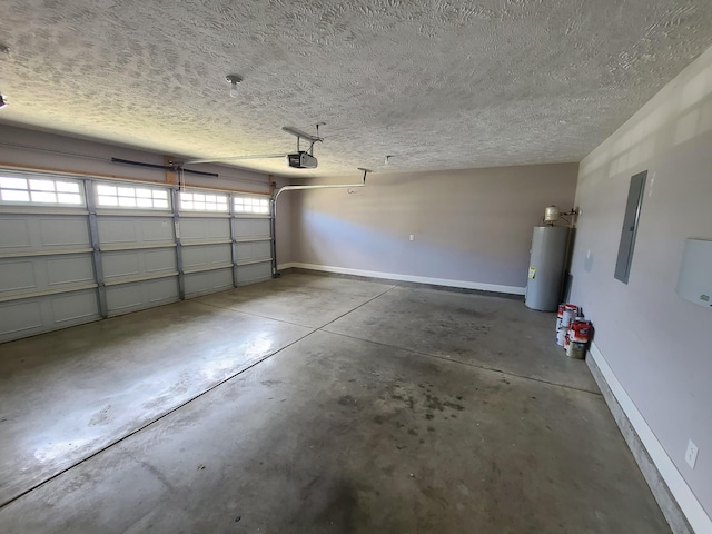 garage featuring a garage door opener, water heater, and baseboards