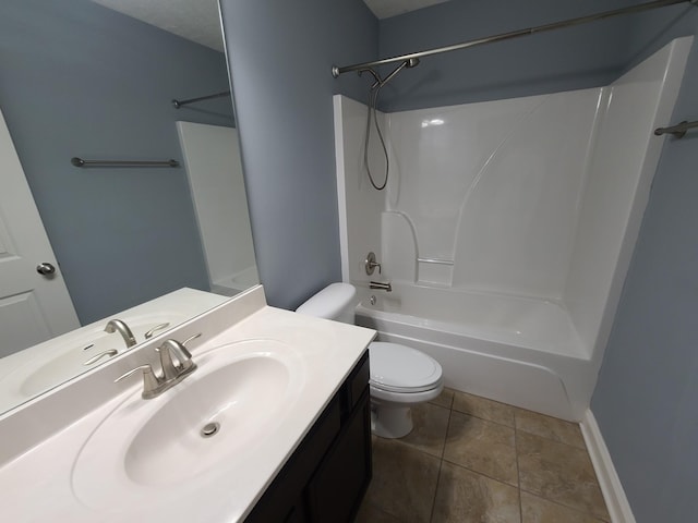 full bath with shower / bathtub combination, toilet, vanity, baseboards, and tile patterned floors