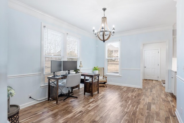 home office featuring an inviting chandelier, crown molding, baseboards, and wood finished floors