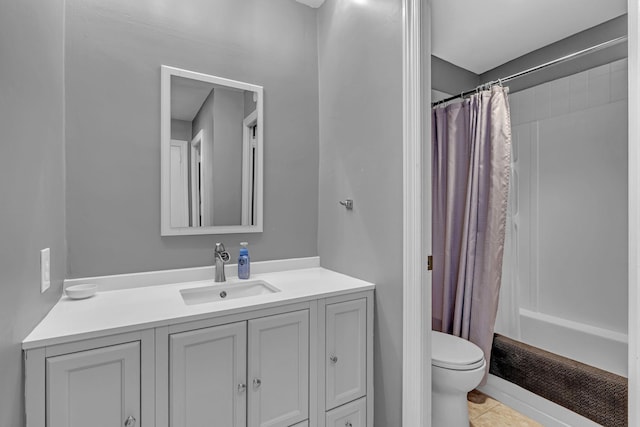 bathroom with a shower with curtain, tile patterned flooring, vanity, and toilet