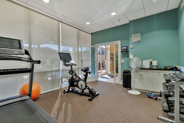 gym featuring a drop ceiling and recessed lighting