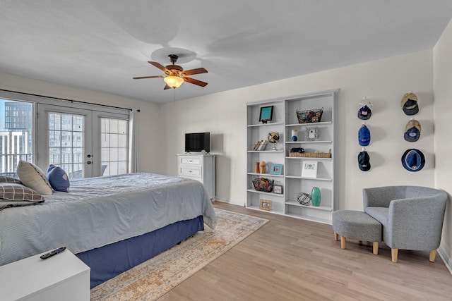 bedroom featuring baseboards, ceiling fan, access to outside, french doors, and light wood-style floors