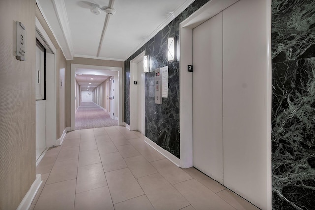 corridor featuring ornamental molding and elevator