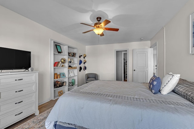 bedroom featuring ceiling fan and wood finished floors